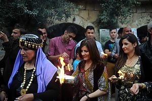 DOHUK, IRAQ - APRIL 16: Yezidis celebrate their New Year in Dohuk, Iraq, on April 16, 2014. The ceremony started in Lalish Temple, the main Yezidi temple (60 km northern Mosul city in Shekhan town), and the candles are lit in all the corners of the Temple. They kiss Baba Sheikh's (spiritual leader) hand and walk to the area which make 365 fire for a year. The New Year Celebration is special and it has historical indication for Yezidis that refers to Yezidi civilization and existence. (Photo by Idris Okuducu/Anadolu Agency/Getty Images)